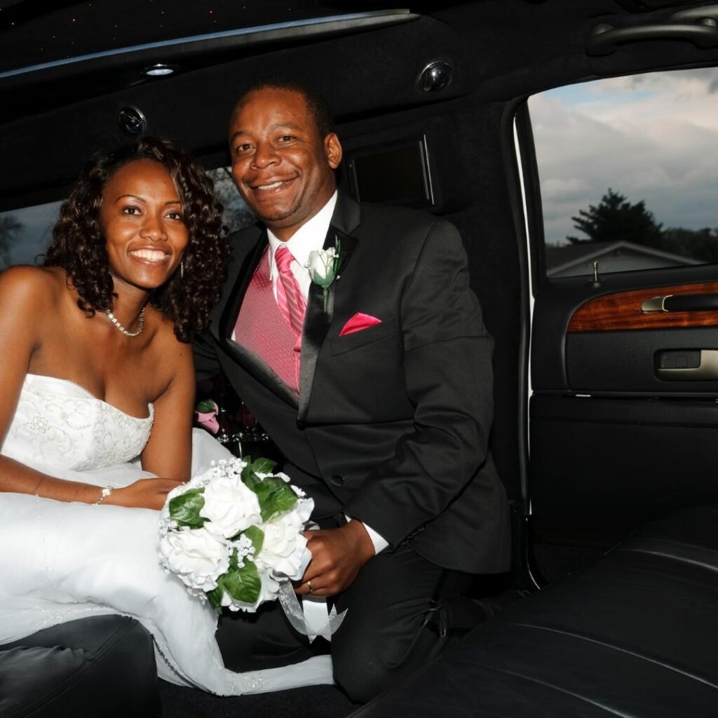 the bride and groom in their wedding limo